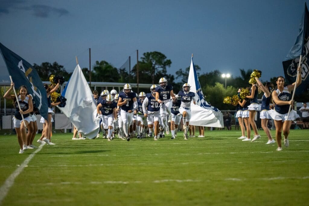 Football team coming onto the field