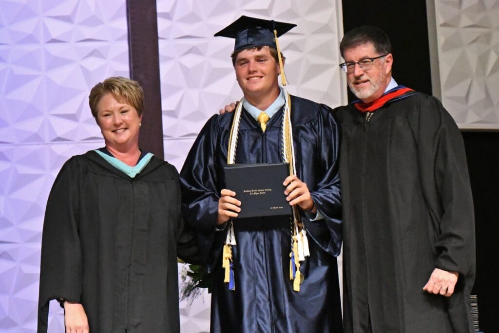 Graduate with diploma